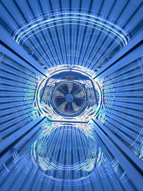 Abstract blue digital tunnel with concentric circles and radiating lines creating a symmetrical, futuristic geometric pattern